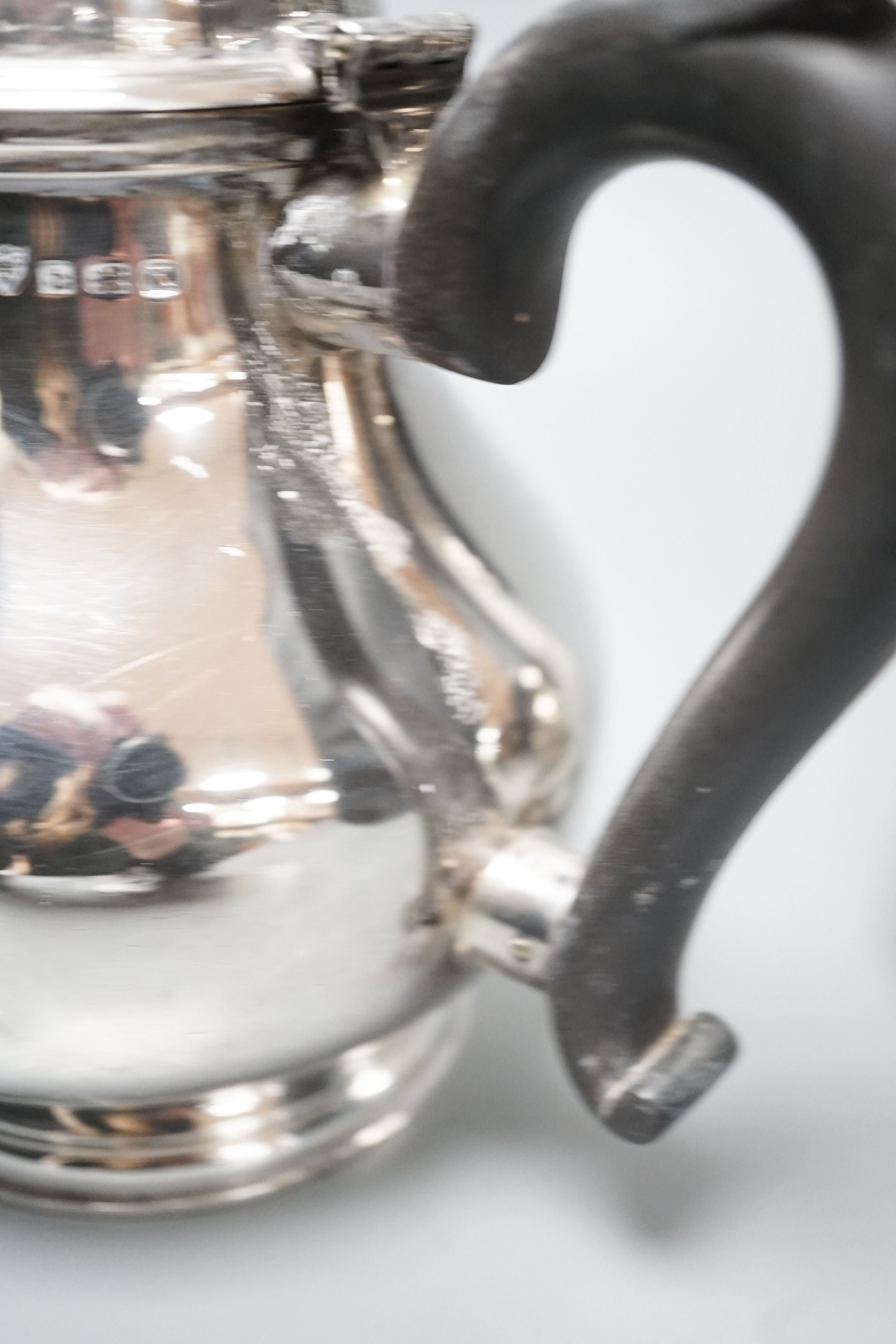A 1930's silver coffee pot and a similar silver how water pot, Birmingham, 1934 & 1935, gross 39oz.